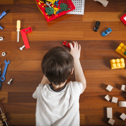 Kid with toys on Vinyl flooring | Chillicothe Carpet